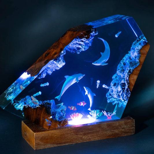 Decorative lamp in the shape of a dolphin family, made of epoxy resin.