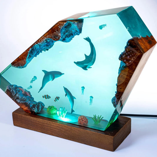 Decorative lamp in the shape of a dolphin family, made of epoxy resin.